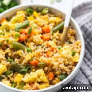 A bowl of Instant Pot fried rice with green onions.
