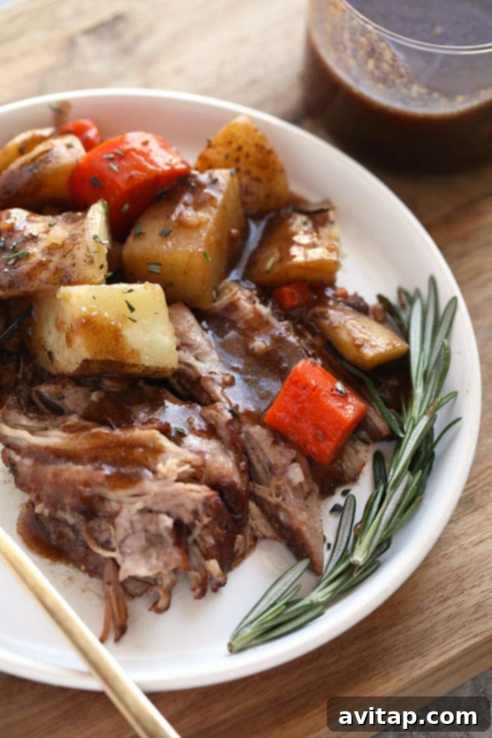 Pork roast and vegetables with balsamic wine glaze on a plate