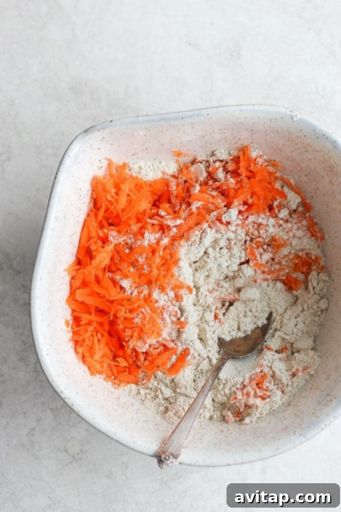 All ingredients for healthy carrot cake pancakes laid out on a kitchen counter.