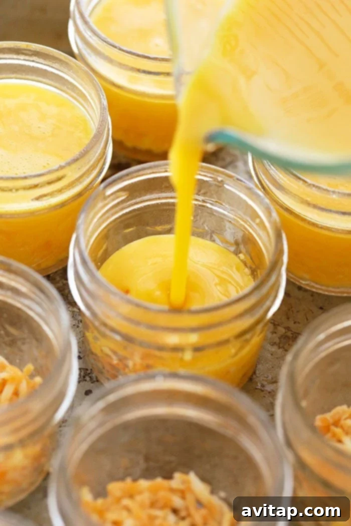Pouring egg mixture into mason jars for sous vide egg bites.