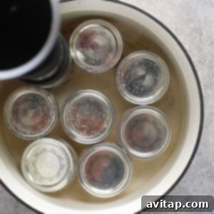 A pot filled with sous vide egg bites, each jar sealed with a lid.
