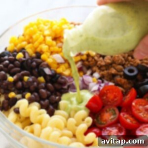 A vibrant and appetizing close-up of Healthy Taco Pasta Salad, showcasing its rich colors and fresh ingredients, ideal for a hearty meal.