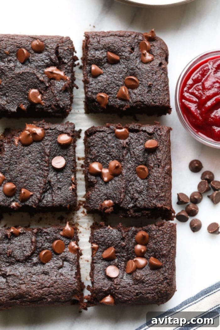 Irresistibly fudgy and wholesome baked beet brownies, ready to eat. Close-up of baked fudgy beet brownies, showcasing their rich texture.