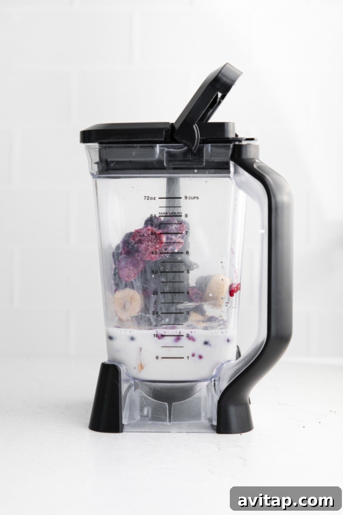 All triple berry smoothie ingredients placed inside a blender, ready to be blended.