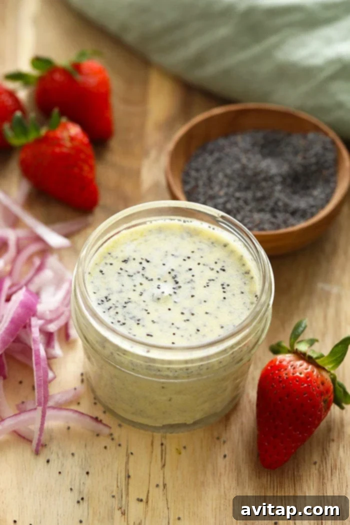 A small jar of freshly prepared poppy seed dressing, ready for storage in the refrigerator.