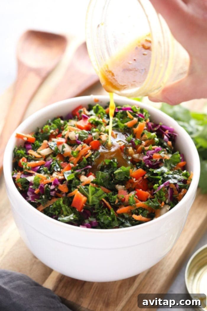 This Asian Salad Dressing is made with garlic, apple cider vinegar, maple syrup, and a little soy sauce. It's the perfect healthy salad dressing to top on your favorite kale salad or use as a chicken marinade! Delicious and Healthy Asian Salad Dressing