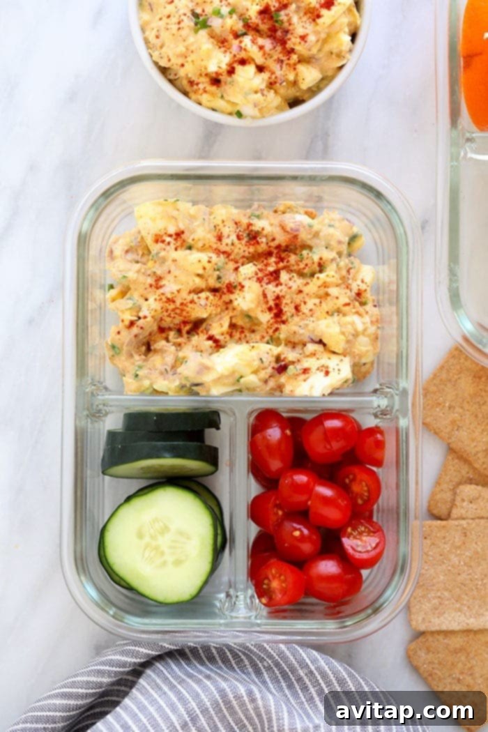 This Tuna Egg Salad blends the flavors you love from tuna salad with egg salad for a satisfying and protein-packed lunch! Filled with a short list of real ingredients, this tuna egg salad recipe can't be beat. Lunch is served! Tuna egg salad portioned into a meal prep container, ready for a healthy lunch