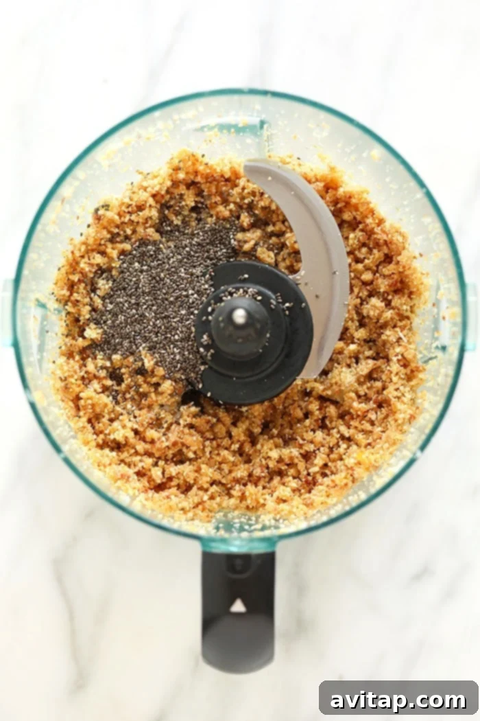 Energy ball ingredients including cashews, dates, and lemon zest in a food processor