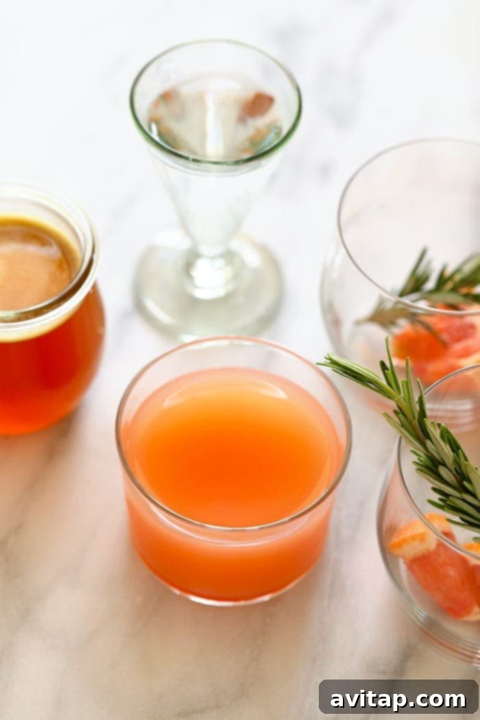 grapefruit juice being poured into a glass