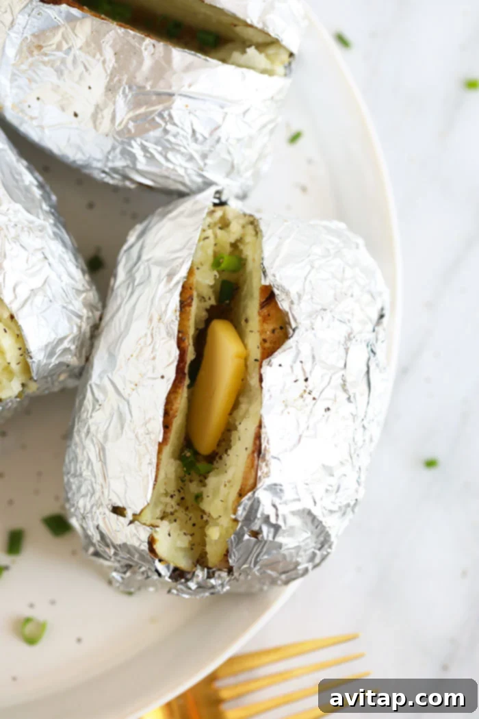 Foil-Wrapped Baked Potatoes 7 Fluffy Idaho potatoes wrapped in foil, perfectly baked and served with melting butter.