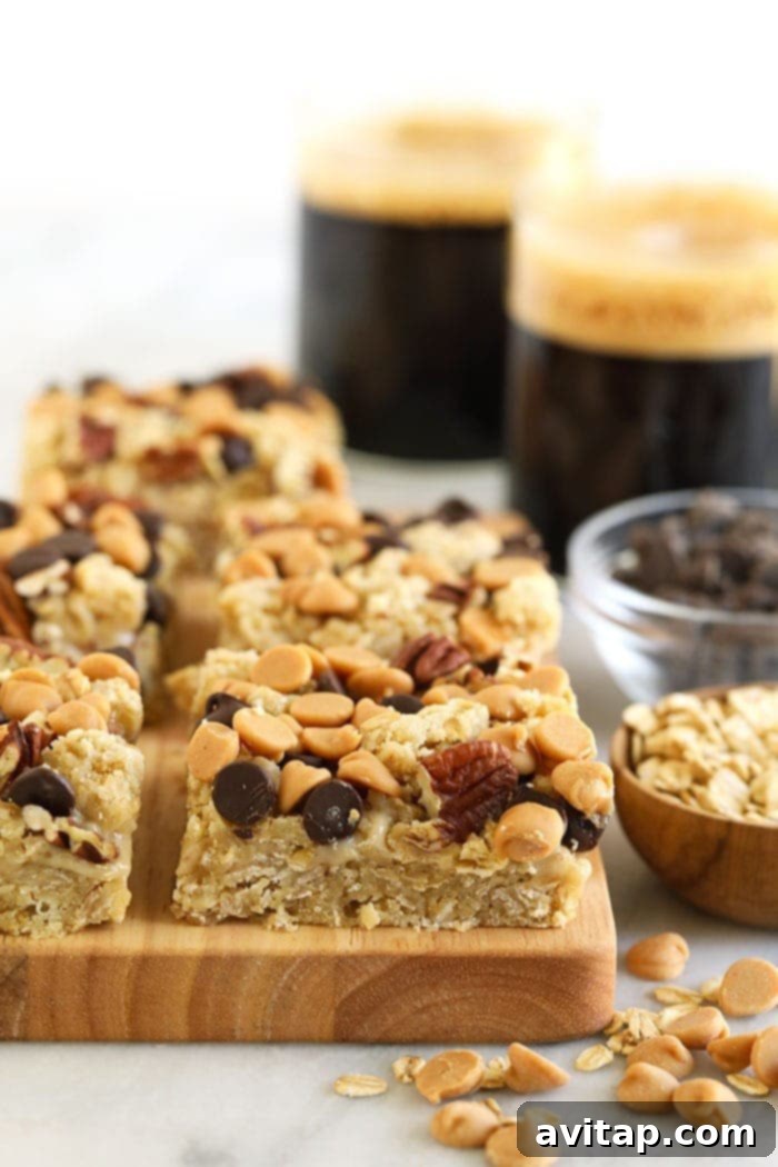 Healthy Carmelita bars arranged neatly on a wooden cutting board