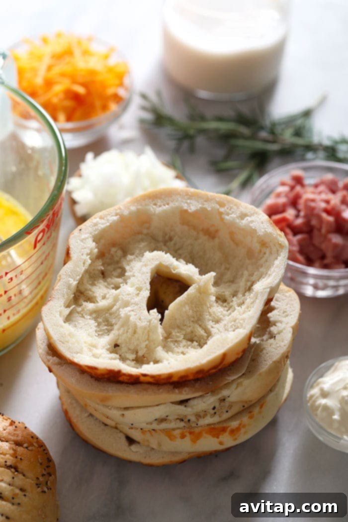 A perfectly hollowed-out everything bagel half, ready to be filled with quiche mixture
