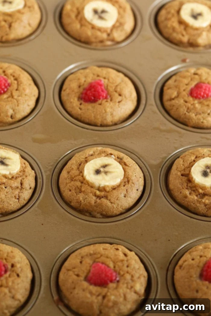 Banana Pancake Muffins baking in the oven for a golden finish. Freshly baked banana pancake muffins in a muffin tin, being drizzled with rich maple syrup.