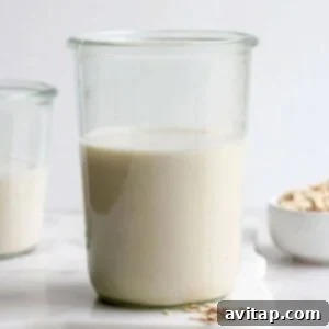 A recipe for oat milk, freshly poured into a glass.