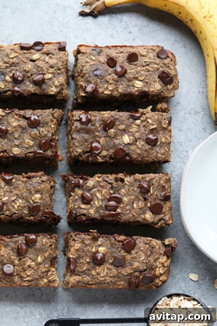 Oatmeal Chocolate Chip Bars Close-up of baked oatmeal chocolate chip bars, showcasing the gooey chocolate.