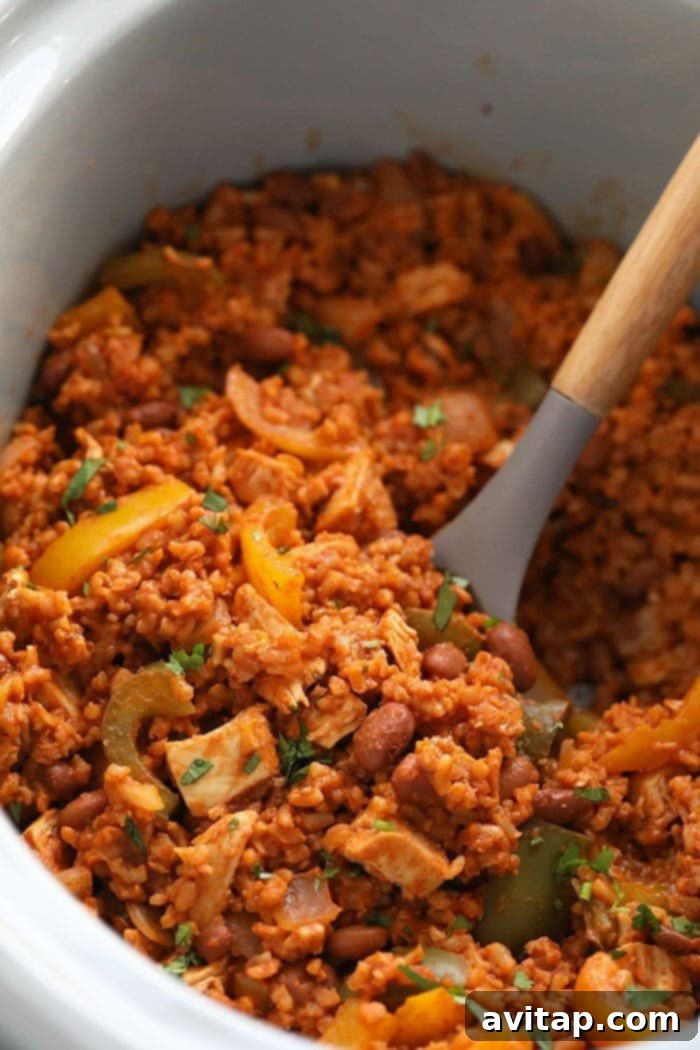 Heartland Chicken Bake 10 A rich Slow Cooker Chicken Enchilada Casserole, cooked to perfection.