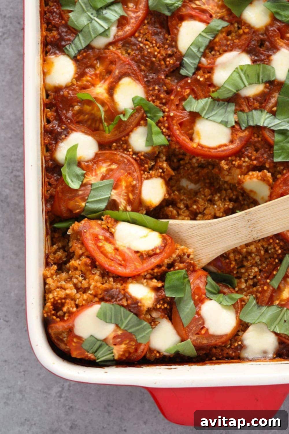 This Tuscan Chicken Quinoa Bake is packed with Italian flavors, kid-friendly, and has a whopping 40g protein per serving! A delicious Tuscan chicken quinoa bake in a casserole dish.