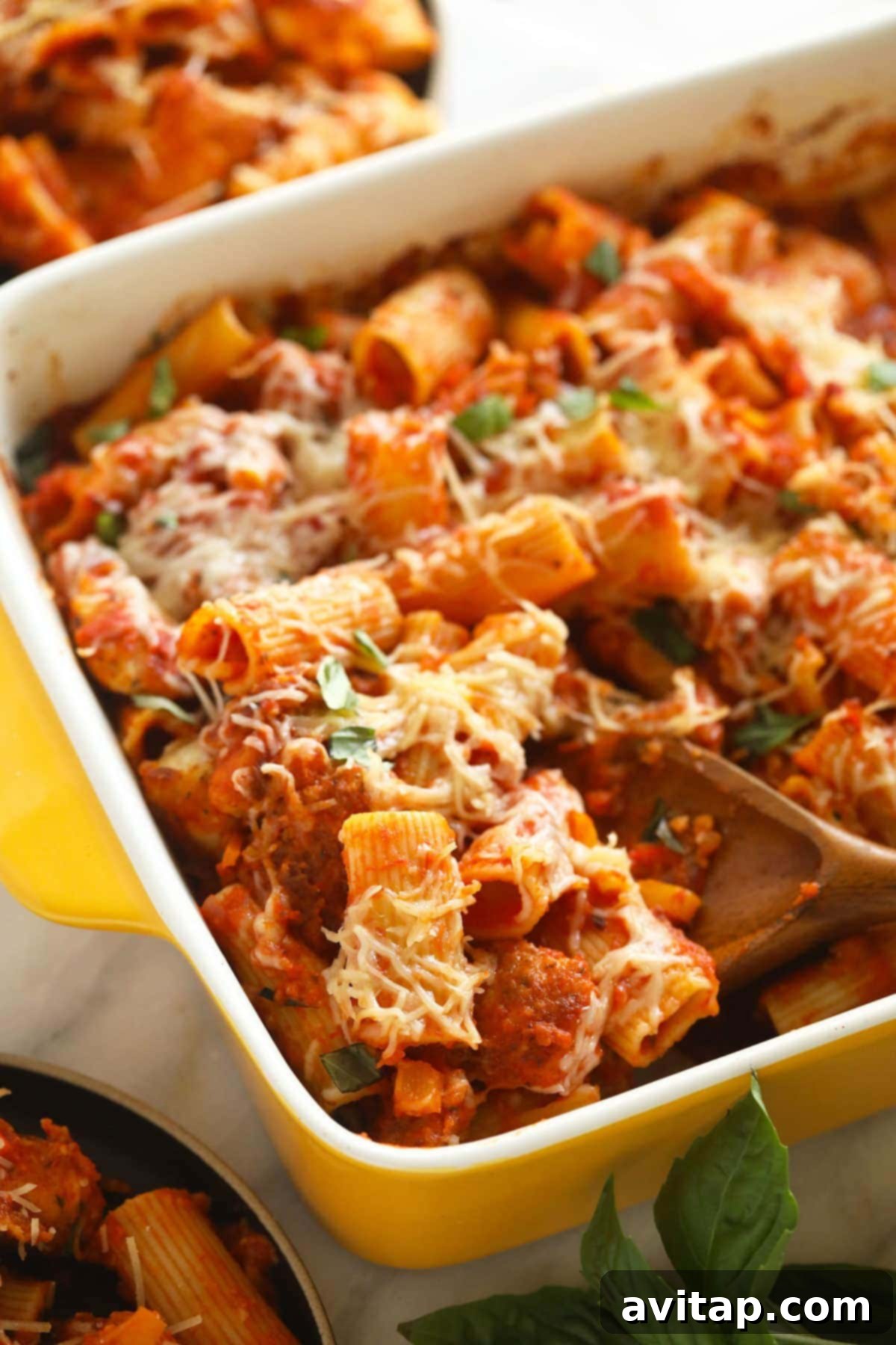 Say hello to the most delicious chicken parmesan casserole. This pasta casserole has crispy chicken, savory marinara sauce, and lots of CHEESE. It is the perfect family dinner that everyone will love! Chicken parmesan baked in a casserole dish, featuring crispy chicken, marinara, and cheese.