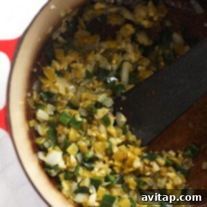 Zesty Chicken and White Bean Chili 4 Cooking diced onions and peppers in a Dutch oven, forming the flavor base for the chili.