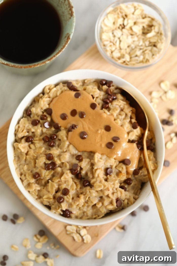 A delicious bowl of microwave oatmeal topped with creamy cashew butter and melted chocolate chips, ready for a healthy breakfast.