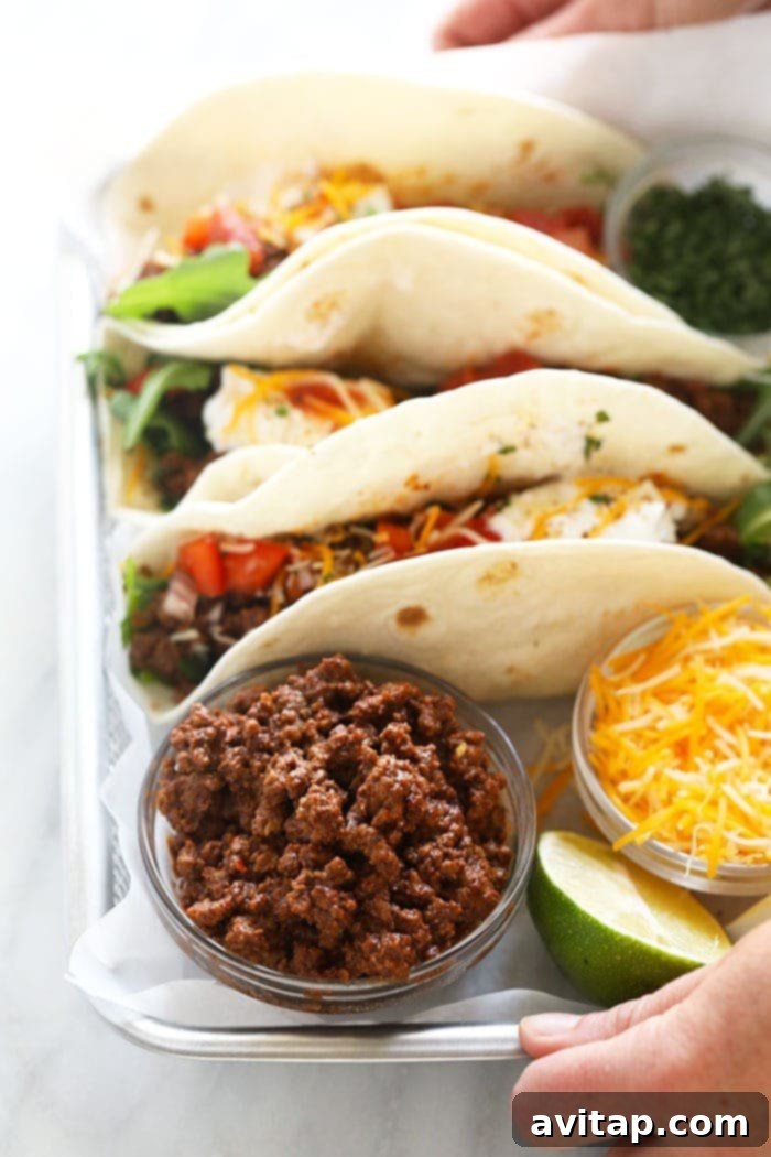 Flavorful beef tacos showcasing the irresistible taste of homemade seasoning and vibrant garnishes. Delicious beef tacos, perfectly flavored with homemade taco seasoning and garnished with fresh toppings.