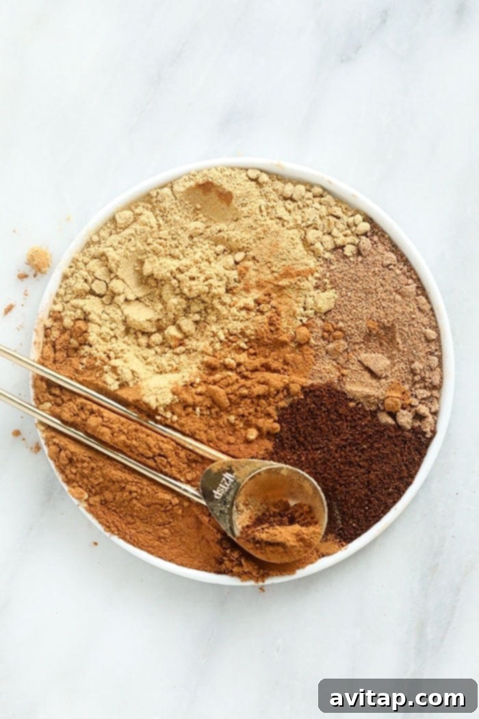 A vibrant selection of homemade pumpkin pie spices displayed beautifully on a plate, ready for your next fall recipe.