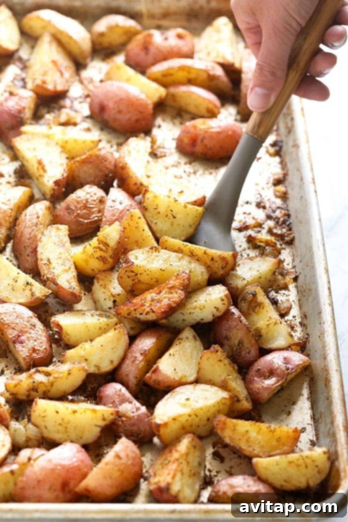 Tossing red potatoes on a pan