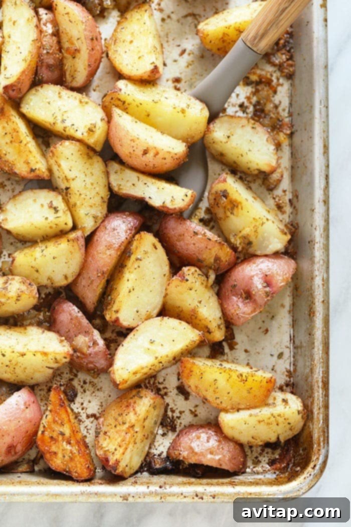 Tossing red potatoes on a pan