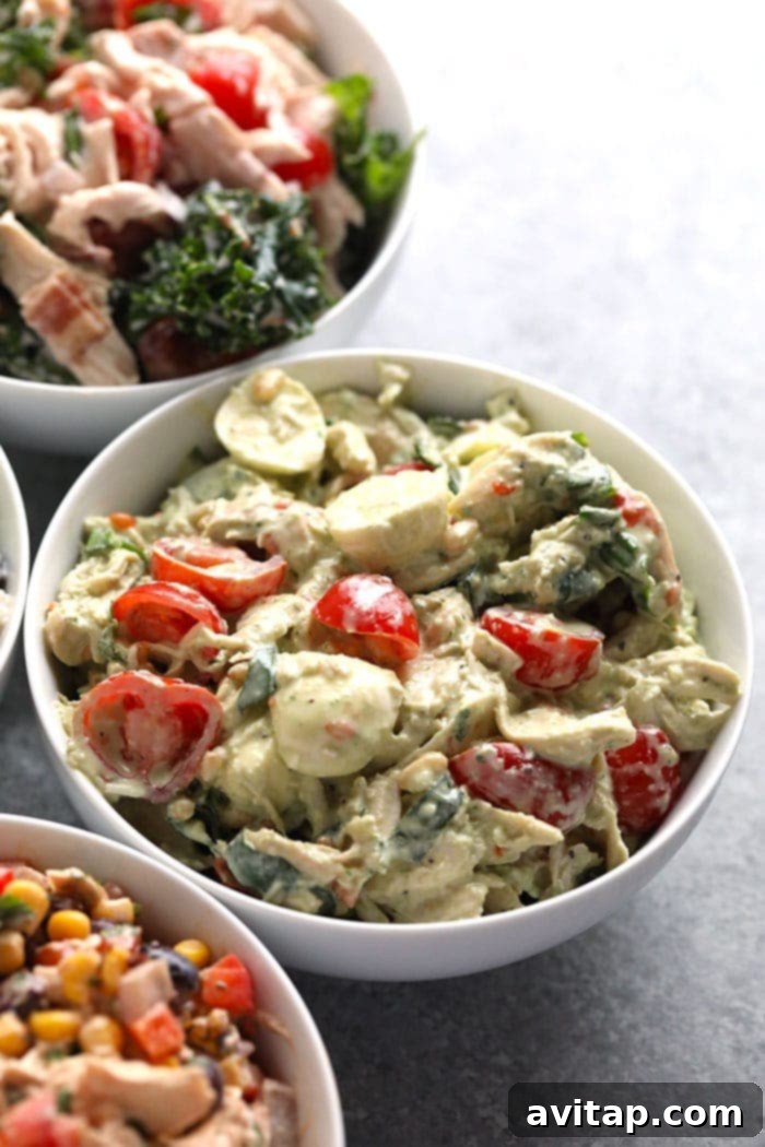Creamy Pesto Chicken Salad for a Healthy Lunch or Easy Dinner A beautifully presented bowl of creamy pesto chicken salad, ready to be enjoyed as a healthy lunch or dinner.