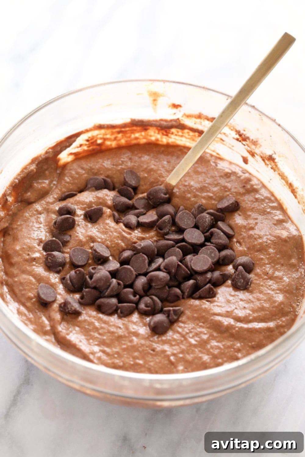 Perfectly Mixed Pancake Batter for Healthy Chocolate Chocolate Chip Pancakes Healthy chocolate chocolate chip pancake batter in a bowl ready to be cooked