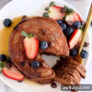 Guilt-Free Double Chocolate Pancakes 2 Healthy chocolate chocolate chip pancakes on a plate