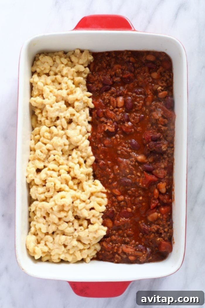 Chili mac and cheese might be the best dinner of all time. Make it once and eat it all week long. Bonus, it's kid-friendly and protein-packed! Chili mac in a casserole dish