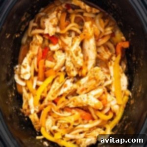 Chicken and peppers in a slow cooker.