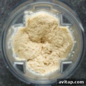 Smooth, blended cauliflower mash inside a food processor bowl.