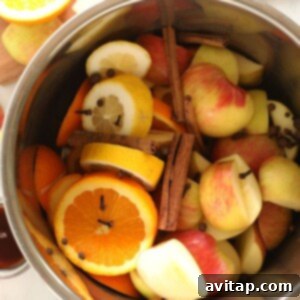 Easy Instant Pot Apple Cider 3 All the fresh ingredients for Instant Pot apple cider inside the pot.