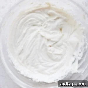 Cream cheese frosting in a bowl, ready to be spread.
