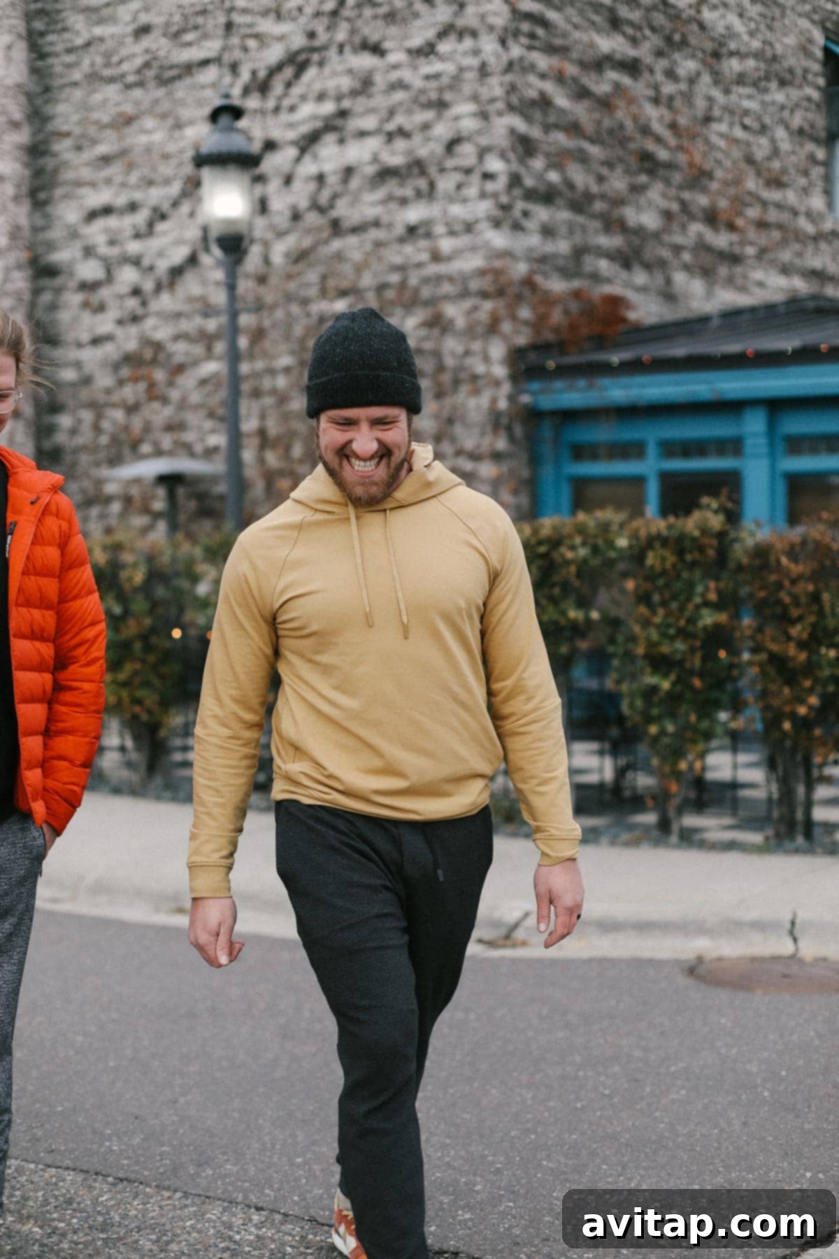 A stylish man wearing a comfortable Lululemon City Sweat Pullover hoodie.