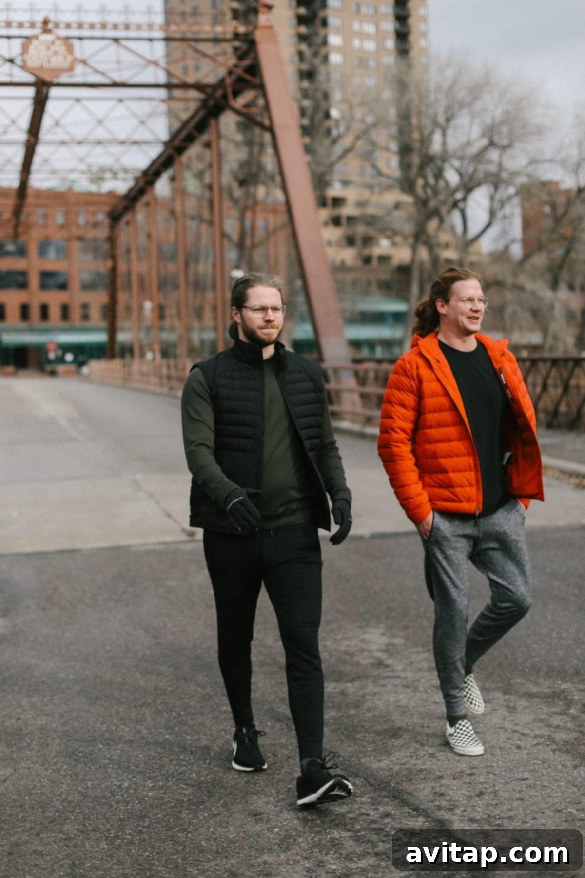 Three Fit Foodie husbands walking confidently across a bridge in their favorite Lululemon joggers.