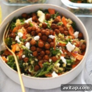 a bowl of quinoa salad with kale and carrots.