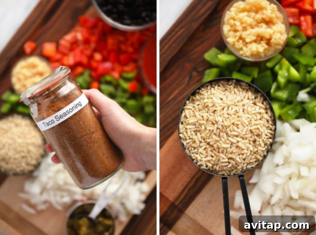 A bowl of homemade taco seasoning next to a bowl of cooked brown rice, highlighting two key ingredients for the skillet.