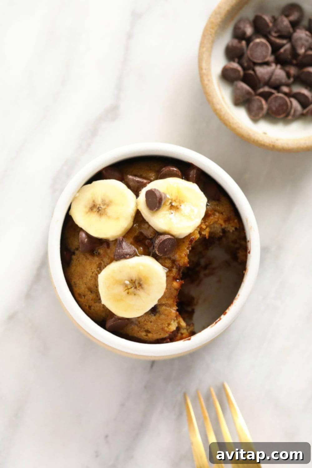Finished banana mug cake served with a spoon