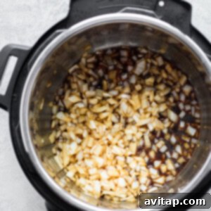 Cooking onions and garlic in Instant Pot.