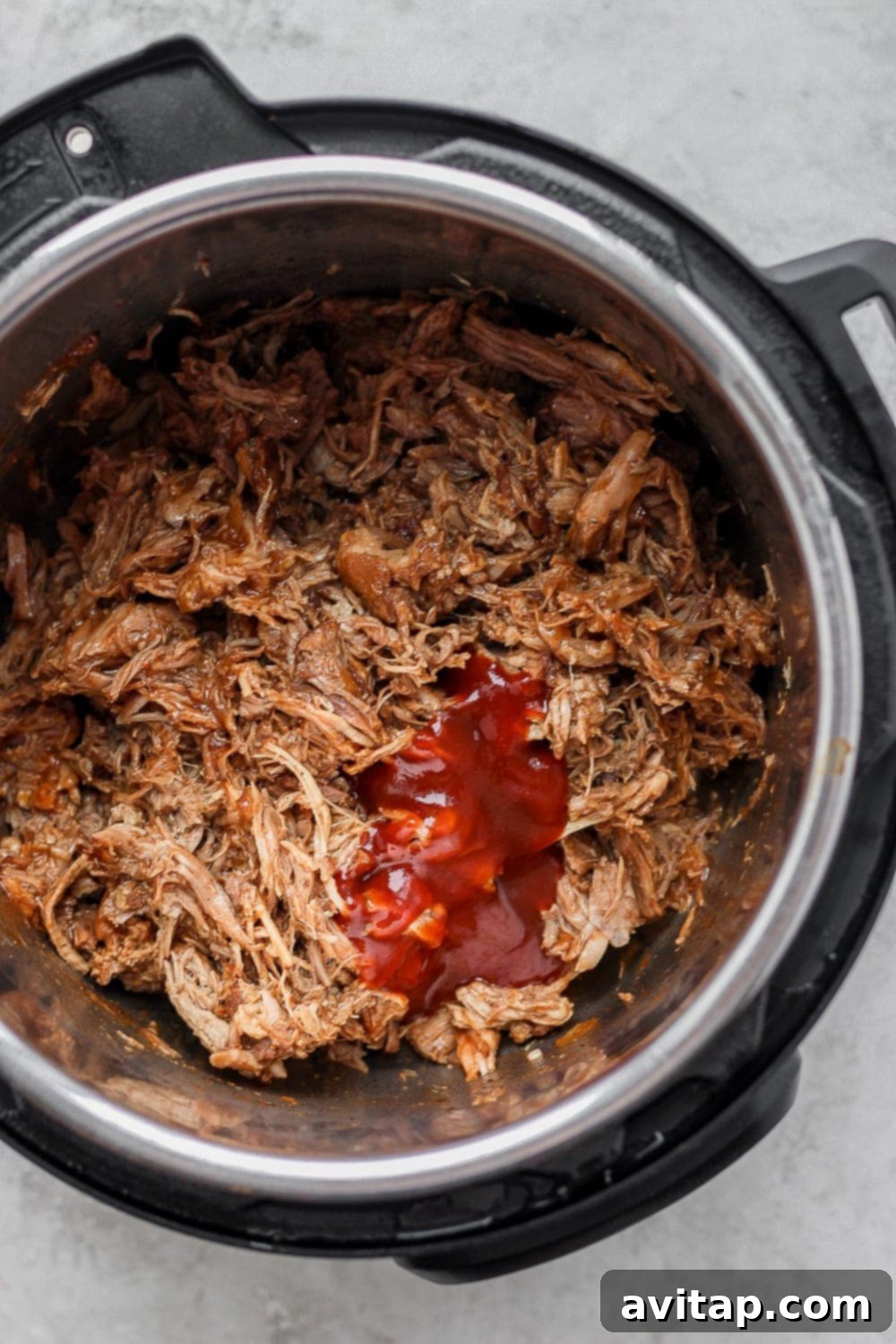 Easy Instant Pot Pulled Pork with BBQ sauce, ready to serve.