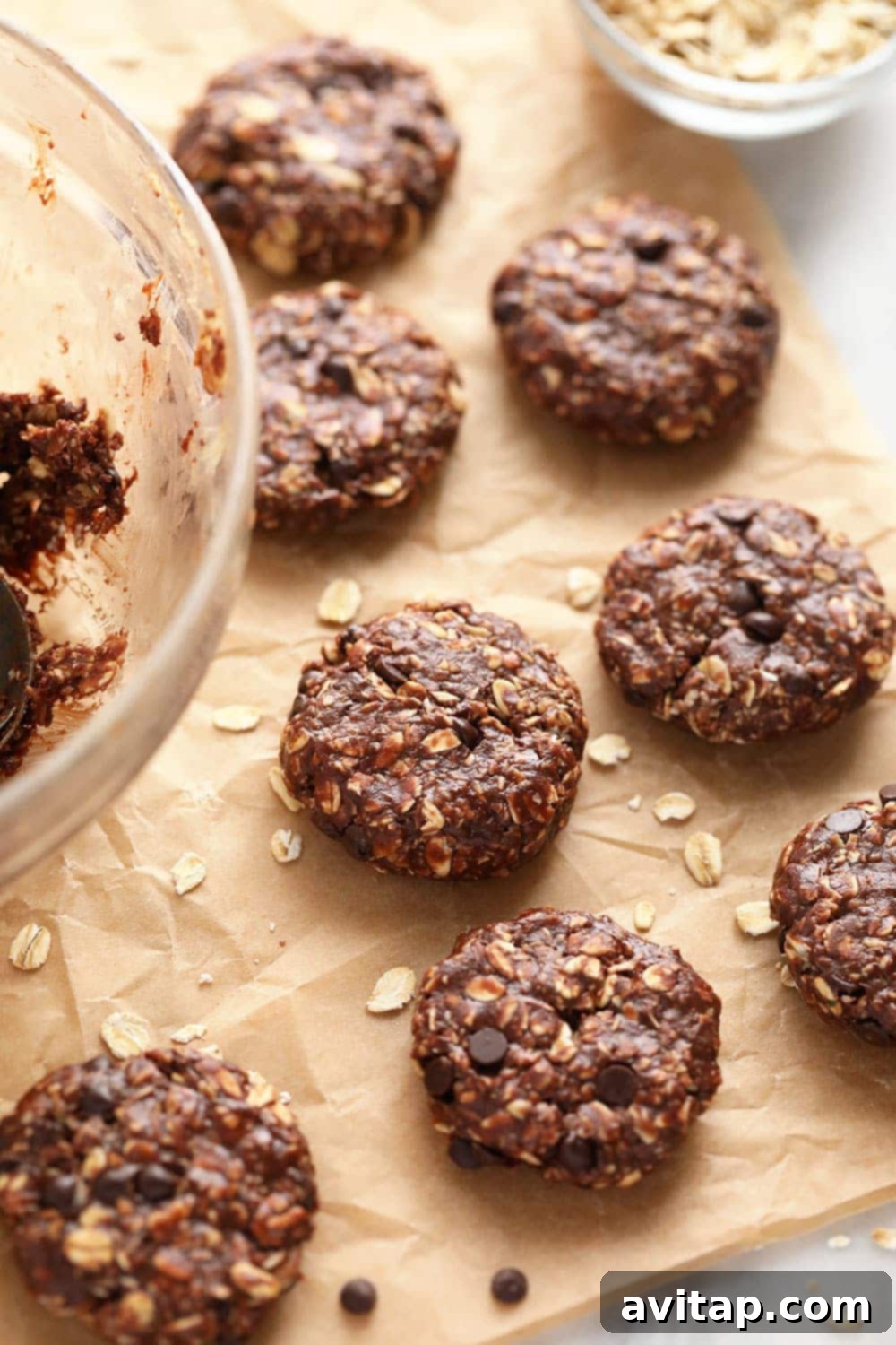 Delicious no-bake chocolate oatmeal cookies artfully arranged on parchment paper, ready to be enjoyed.