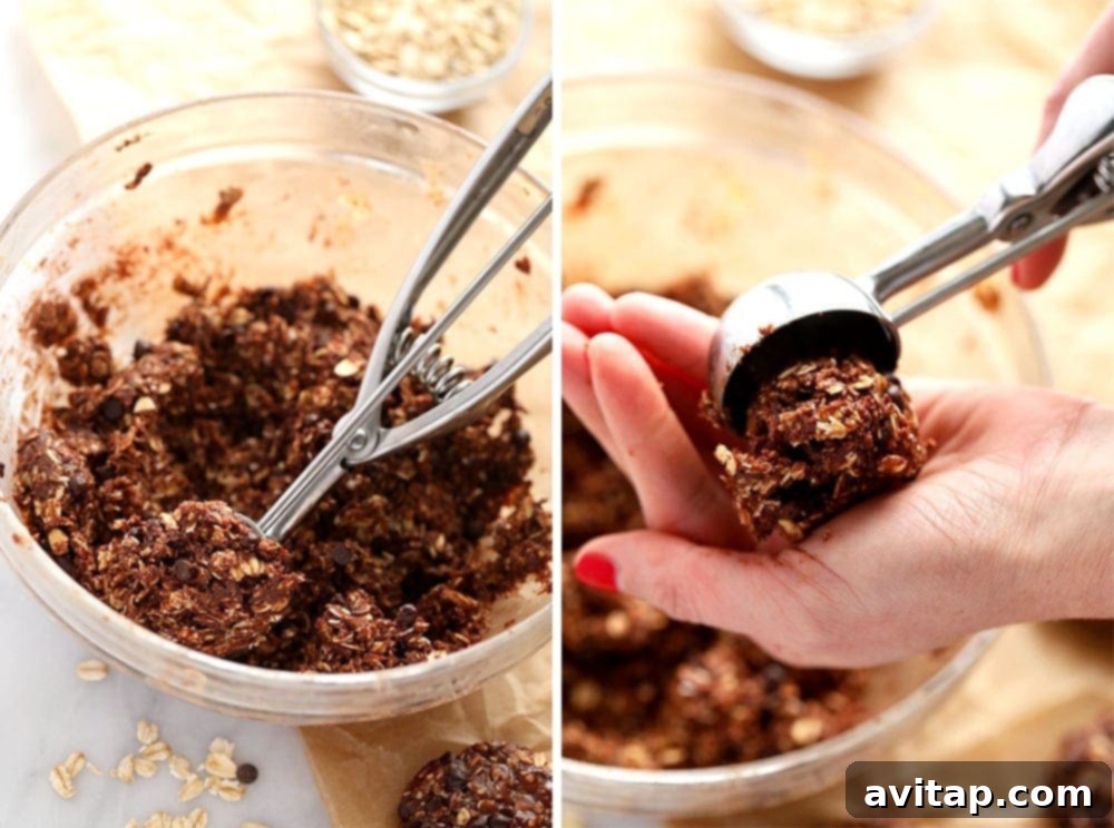 A cook's hands shaping no-bake chocolate oatmeal cookies, demonstrating the simple, hands-on process.
