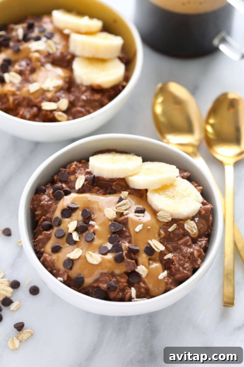 High-Protein Chocolate Peanut Butter Overnight Oats A bowl of delicious Chocolate Peanut Butter Overnight Oats ready to eat, topped with chocolate chips and a peanut butter swirl.