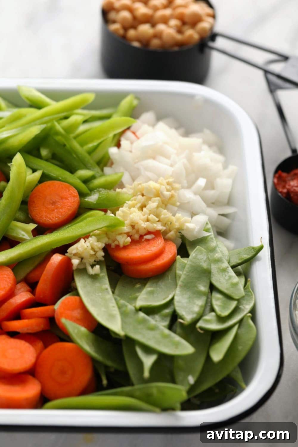 Fresh ingredients laid out for a vibrant vegetarian Thai curry.