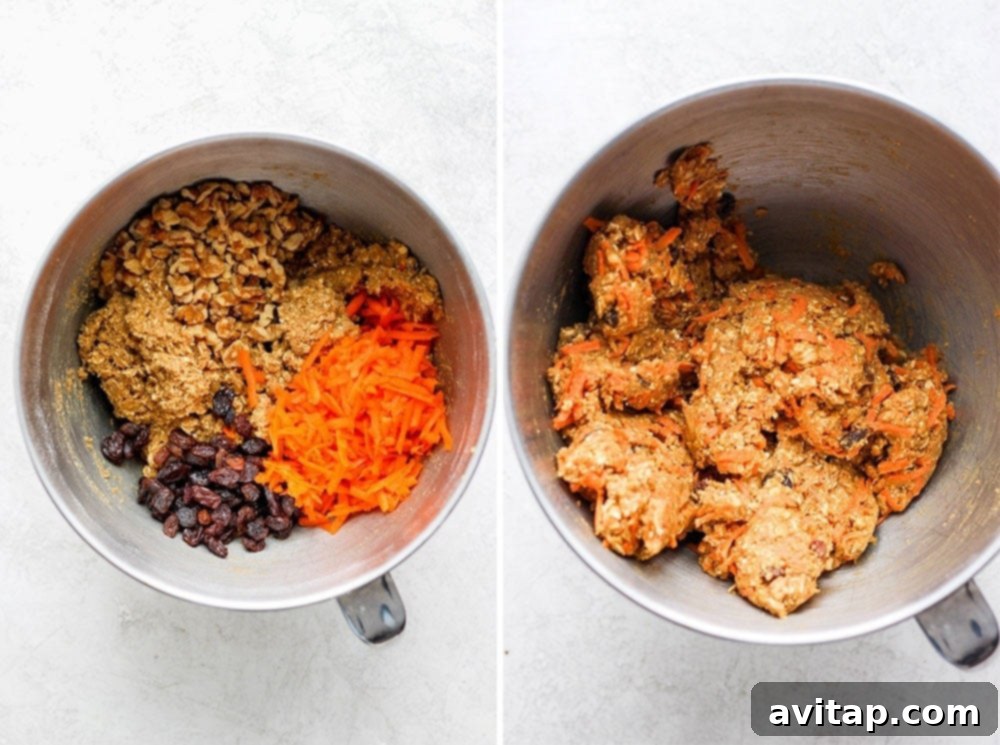 Final Mix: Carrots, Walnuts, and Raisins for Texture and Flavor The cookie dough being gently mixed in a bowl, with grated carrots, chopped walnuts, and raisins clearly visible, ready to be incorporated.