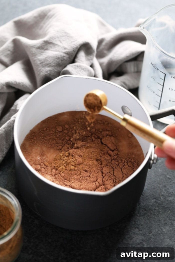 Mixing Vegan Chai Hot Chocolate Ingredients vegan chai hot chocolate ready to be mixed in a saucepan