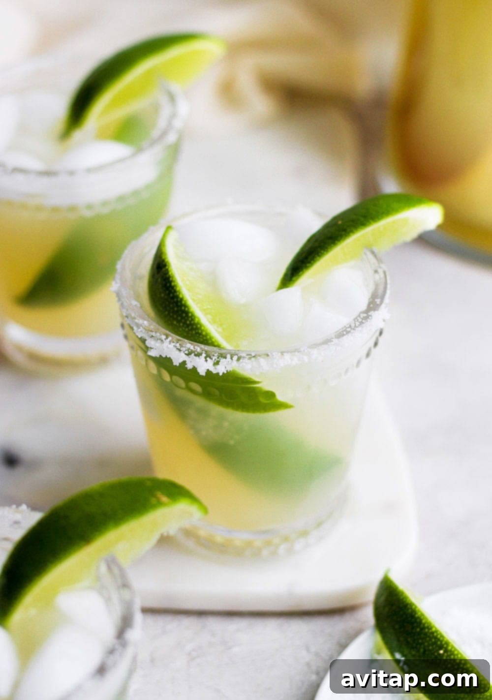 A beautifully garnished skinny margarita in a glass, ready to be enjoyed.